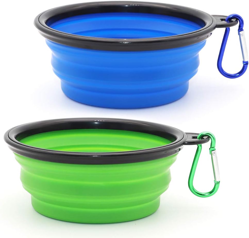 Two expanded collapsible bowls on a white background, blue above green, each with a black rim and a carabiner on a side tab