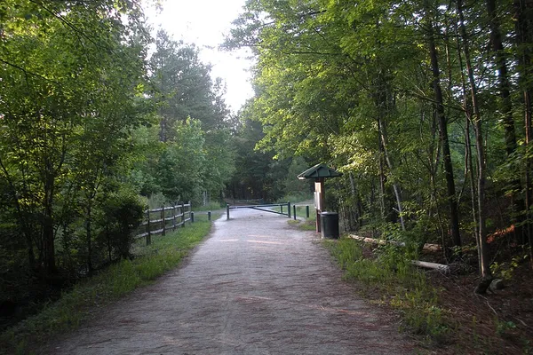 Wide shaded gravel stretch of the American Tobacco Trail in Wake County
