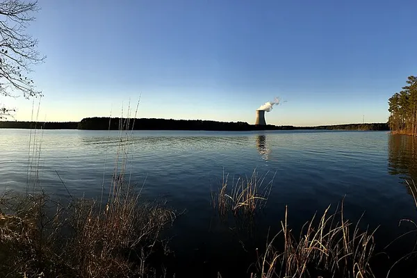 Harris Lake at sunset from Harris Lake County Park, with the power plant cooling tower in the distance